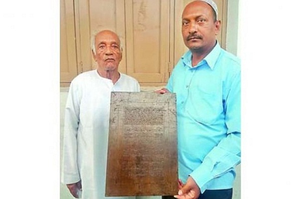 Family in Hyderabad, India, Engraving Quran Verses on Iron Plaques